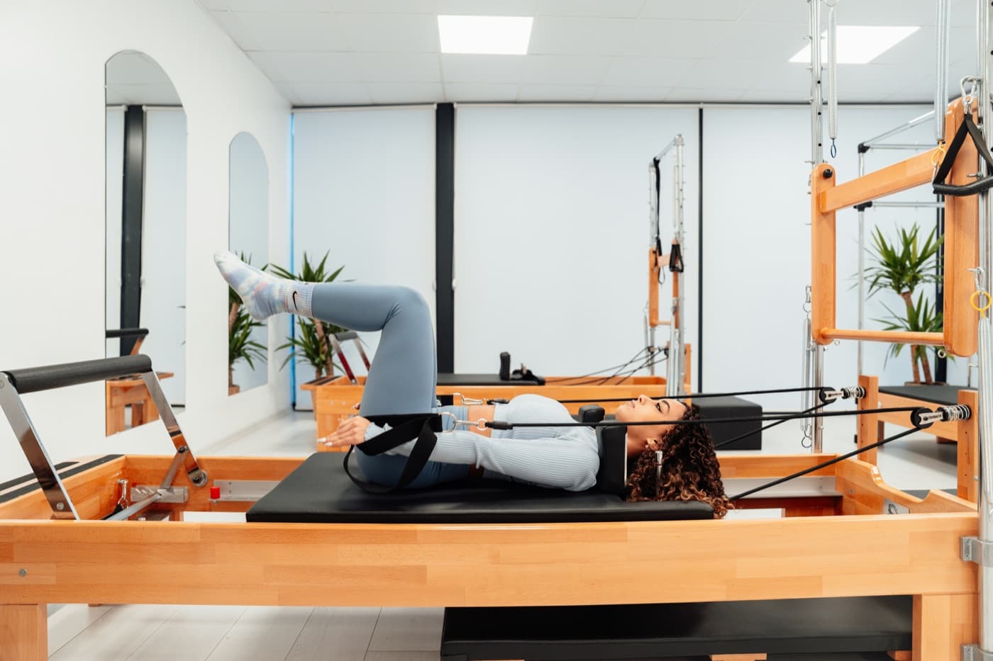 Pilates studio with reformers ready for class